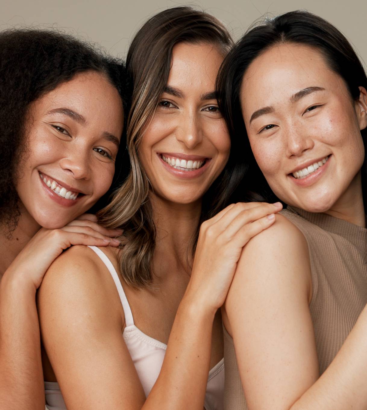New Project (6) Three women smiling for a picture together.